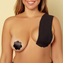 Load image into Gallery viewer, A woman using The Boob Tape and black nipple covers.